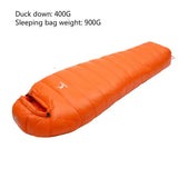 the sleeping bag is orange and has a zipper closure