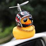 a duck wearing a helmet and a helmet on top of a car