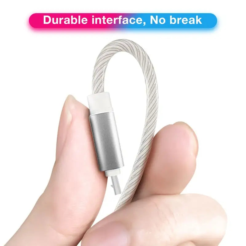 a hand holding a usb cable with a white background