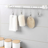 a white towel rack with three towels hanging on it