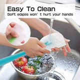 a person washing a bowl with water and a spoon