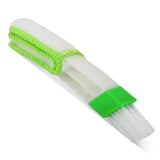 a green and white cleaning brush