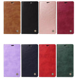 Eight colored faux leather phone cases with magnetic closures.