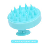 a blue plastic brush with spikes on it