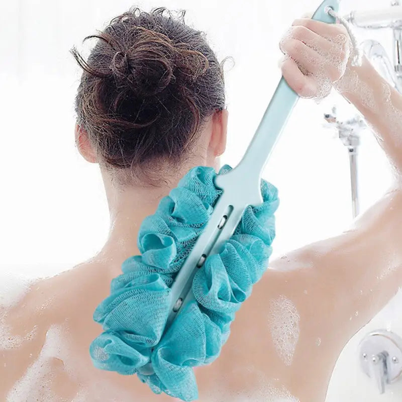 a woman in a bathtub with a blue towel