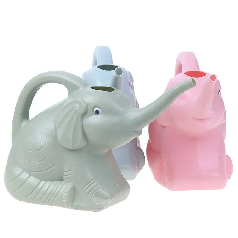 two elephant shaped vases with one holding a pink and one holding a blue