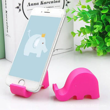 an elephant phone holder with a pink elephant