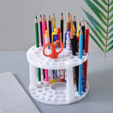 a pencil holder with several colored pencils in it