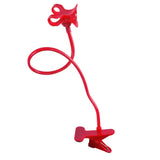 a red plastic object with a metal handle