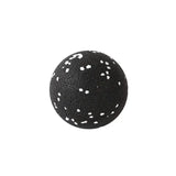 a black and white ball with white spots