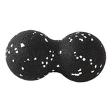 a pair of black and white polka doted leather ear plugs