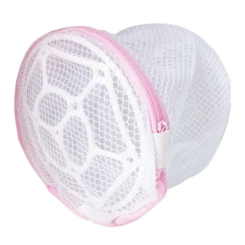 a white mesh bag with pink trim