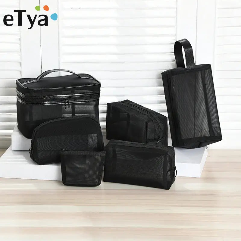 a black travel bag with three compartments and one compartment