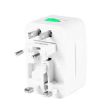 a close up of a white travel adapter with a green button