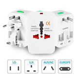 a close up of a white travel adapter with four different plugs