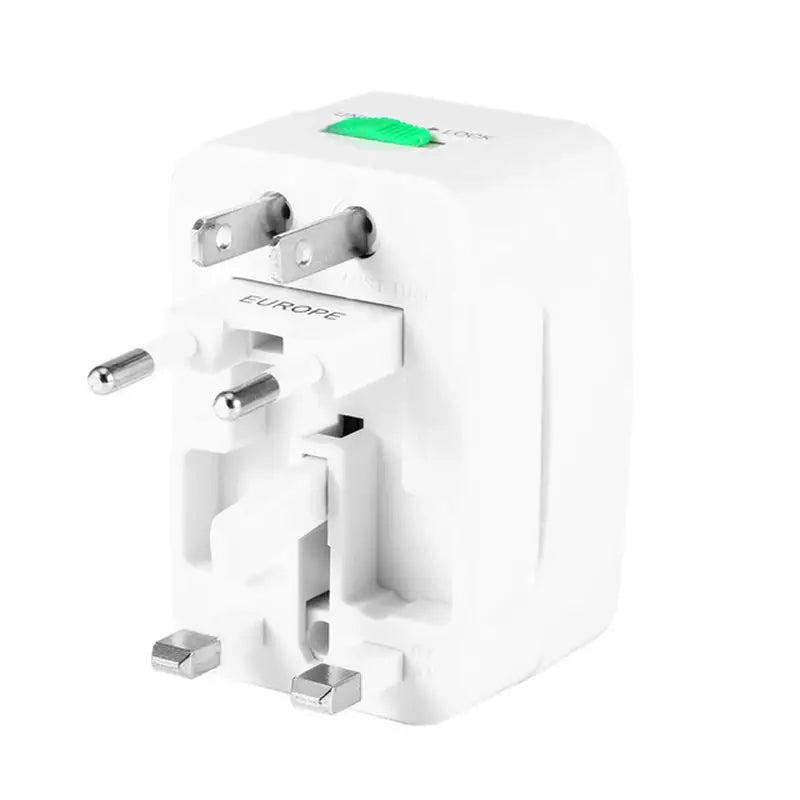 a close up of a white travel adapter plug with a green button