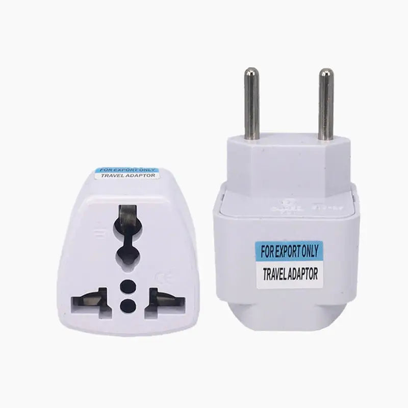 a close up of a white travel adapt plug and a white wall charger