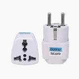 a white travel adapt plug with a white background