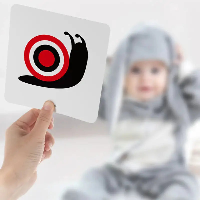 a person holding a card with a target in the middle