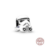 a close up of a star wars trooper helmet charm