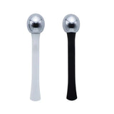 a pair of stainless steel ball and black plastic handle