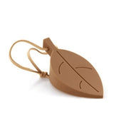 a brown leaf shaped keychai with a brown tag