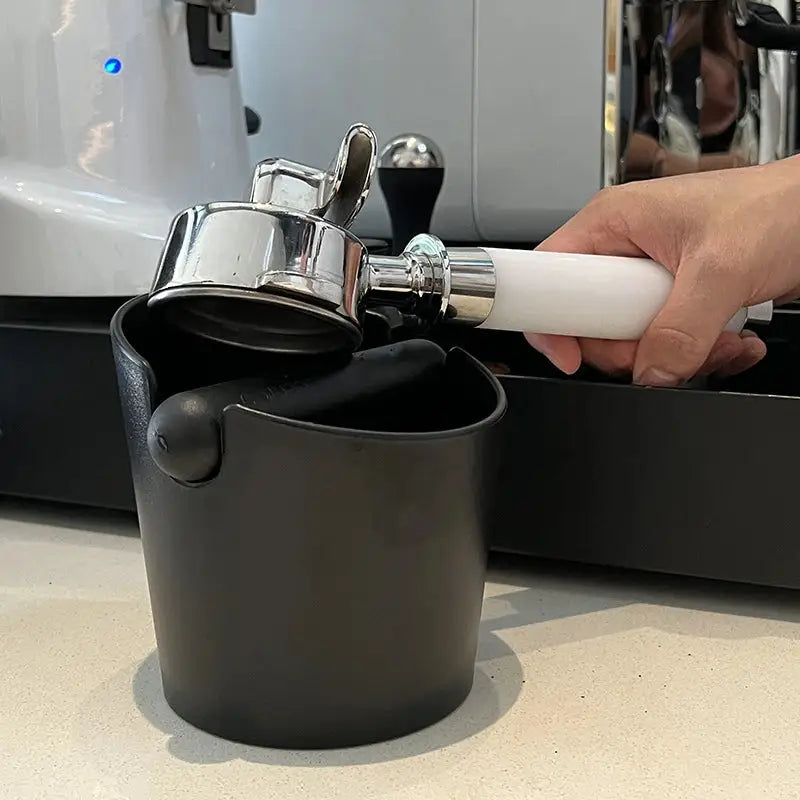 a person is filling a cup with a water bottle