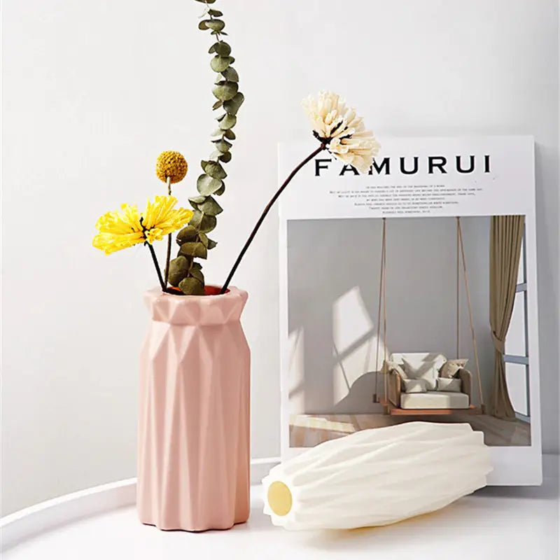 a vase with flowers in it and a magazine