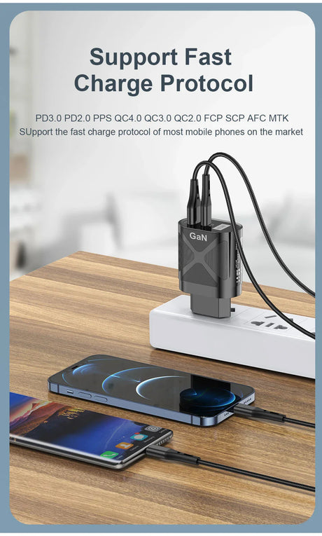 Fast charging adapter with multiple ports connected to smartphones on a wooden surface.