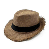 a straw hat with fringes on the br