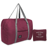 a maroon duff bag with a grey zipper