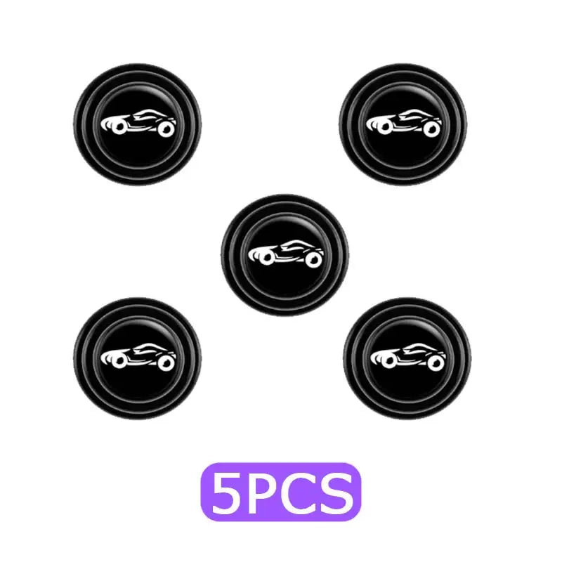 a set of five black buttons with a purple and white background