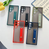 Five clear phone cases with colorful frames and integrated kickstands.