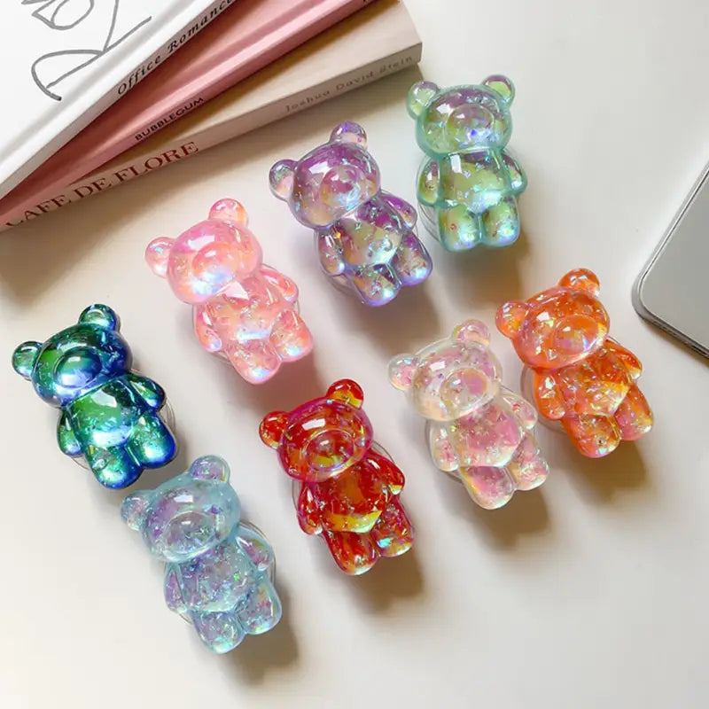 there are five different colored gummy bears on a table