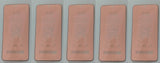 Five rectangular, pinkish-tan cards.