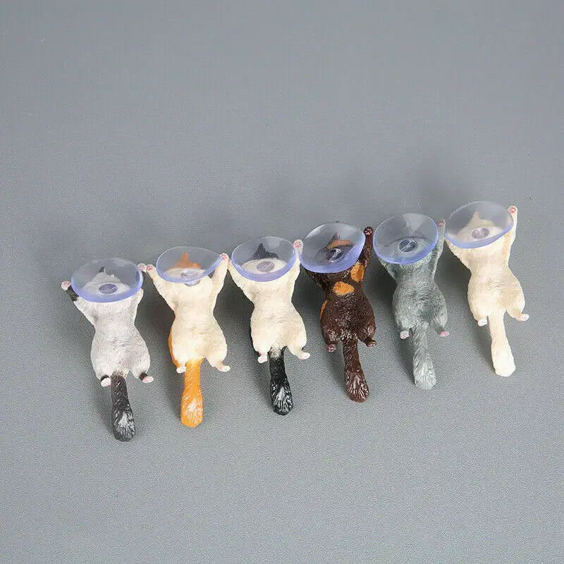 a group of five small plastic animals