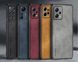 Five smartphones in different colors lined up side by side, showcasing their rear camera arrays.