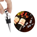 a close up of a person opening a bottle of wine with a corkscrew