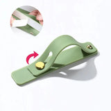 a green plastic bottle opener with a gold handle