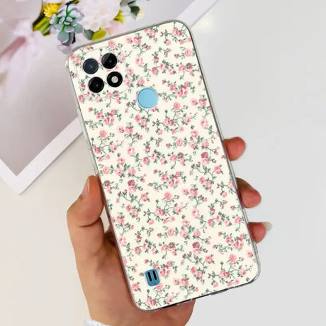 a woman holding a phone case with a floral pattern