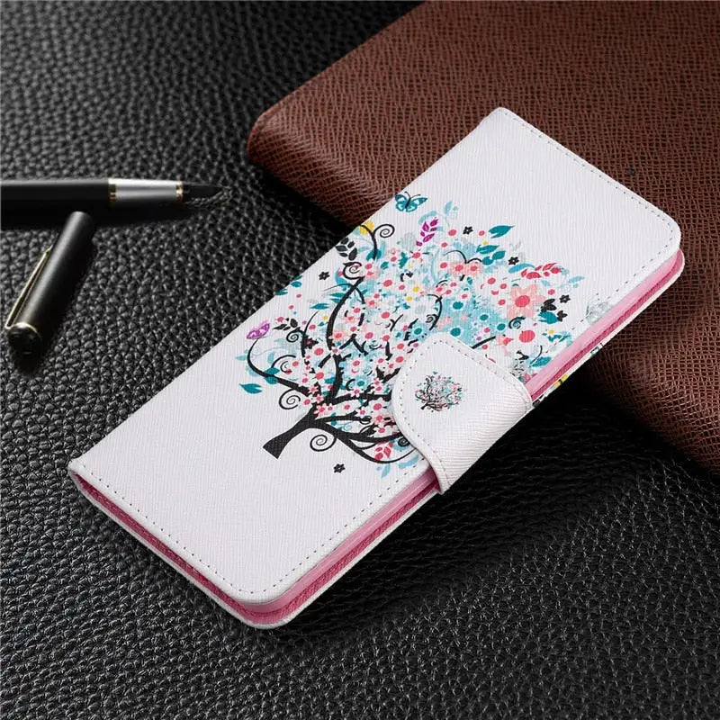 a white phone case with a colorful tree design