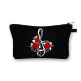 a black zipper bag with a white anchor and red roses