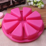 a pink cake pan with a cake cutter on top