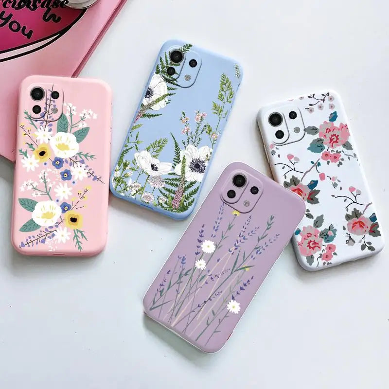 four cases with flowers on them