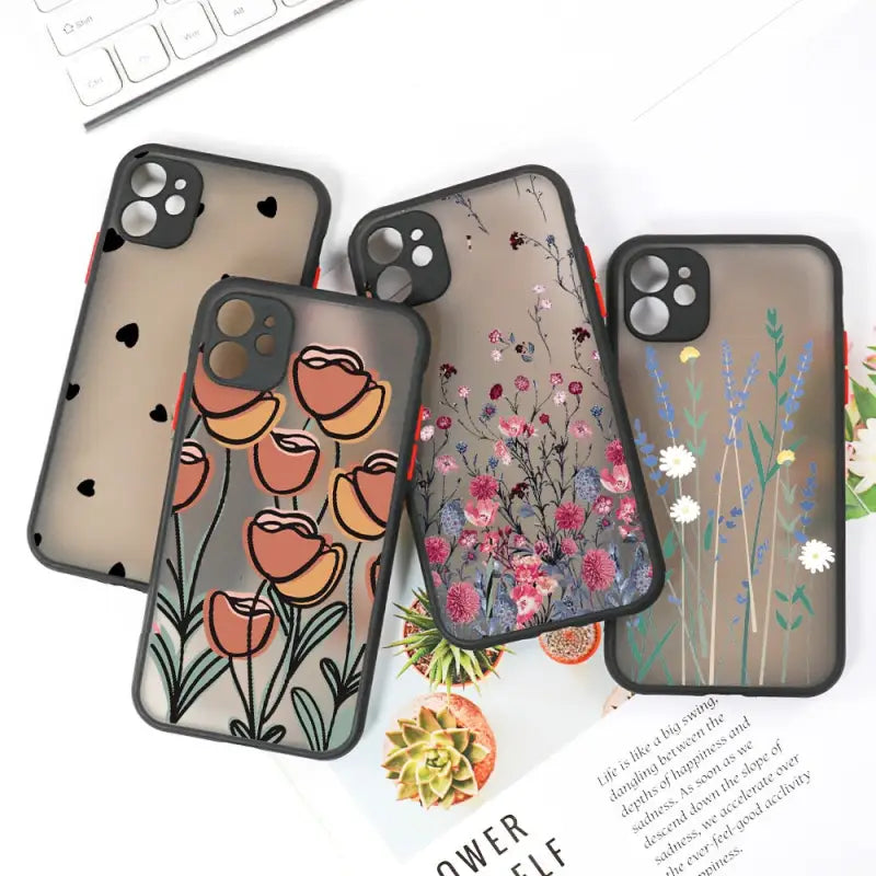 three phone cases with flowers and birds