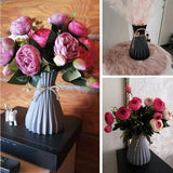 arafed vase with pink flowers and a black vase with pink roses