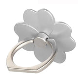 a flower shaped ring with a silver finish