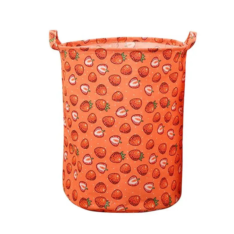 a large orange strawberry print storage bag