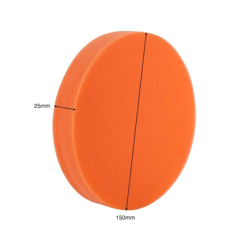 a round orange sponge with a white background