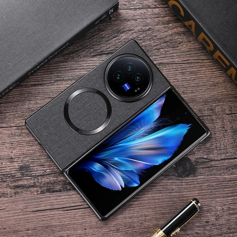 Foldable smartphone with a circular camera module and a vibrant blue feather-like image on its display.